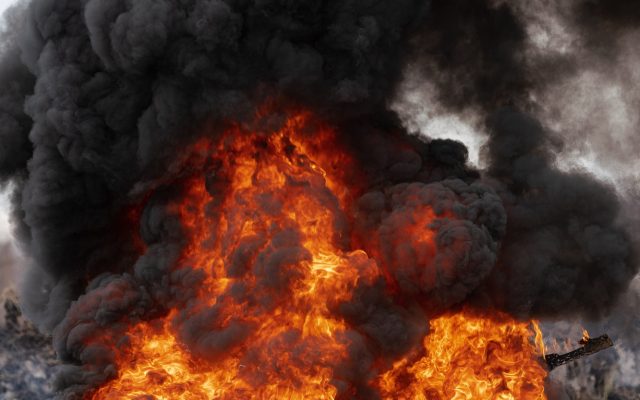 Burning Automobile Tires, Strong Flame of Red Fire and Clouds of Black Fumes
