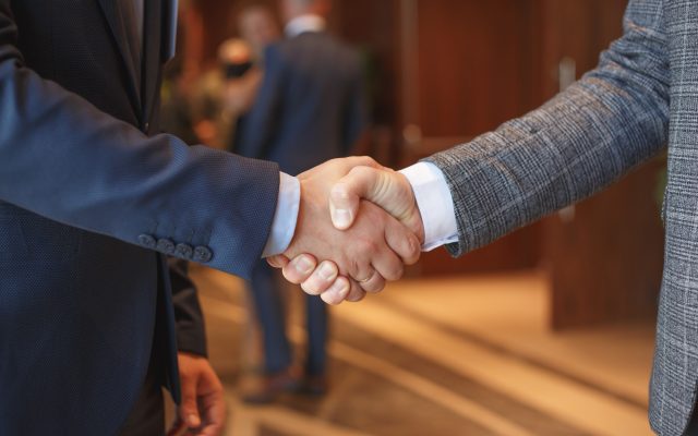 Men shake hands at business meeting